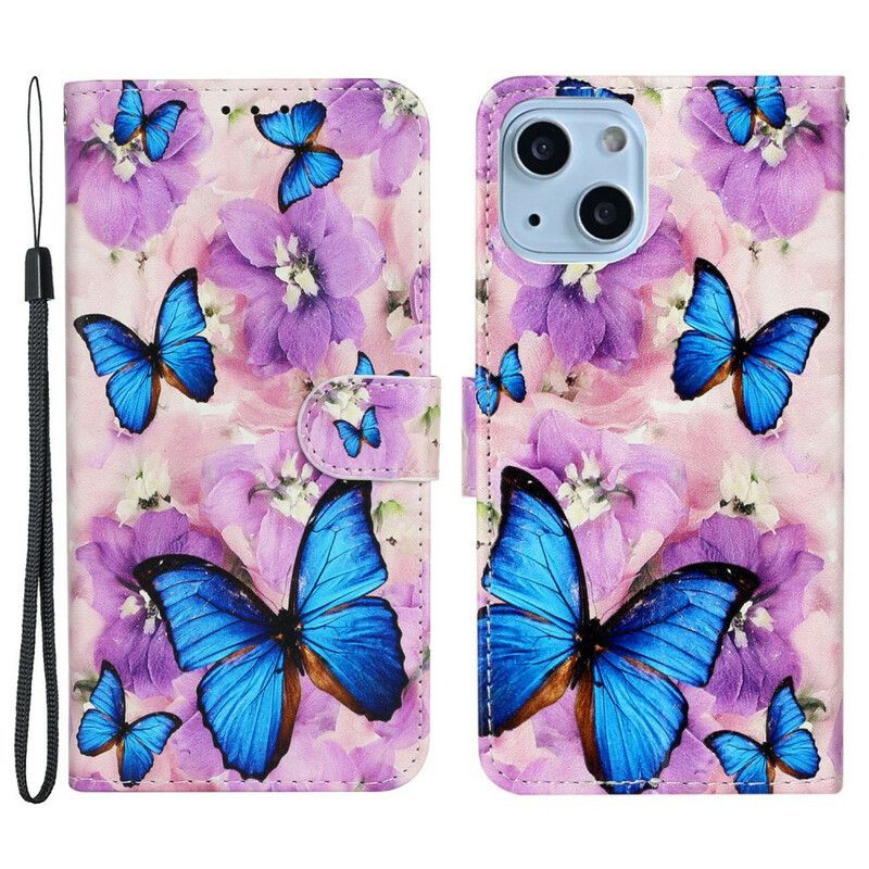 Housse iPhone 13 Mini Papillons Bleus Dans Les Fleurs