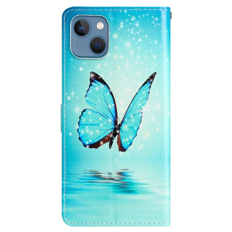 Housse iPhone 15 Papillon Bleu en Vol à Lanière