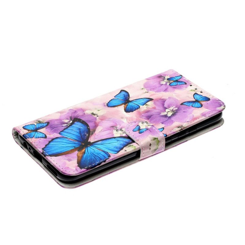 Housse Huawei P Smart 2020 Papillons Bleus Dans Les Fleurs