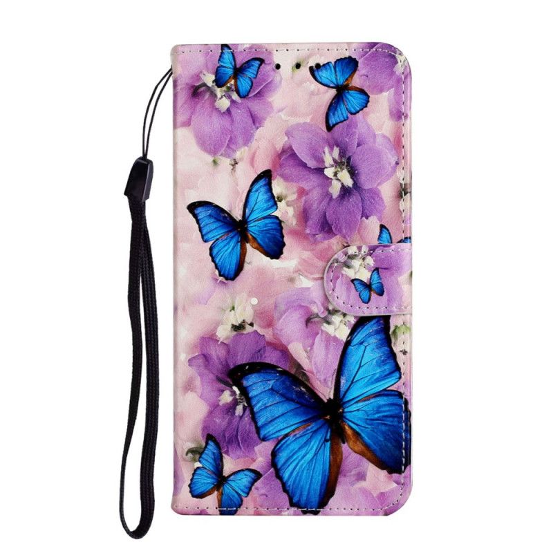 Housse Huawei Y6p Papillons Bleus Dans Les Fleurs