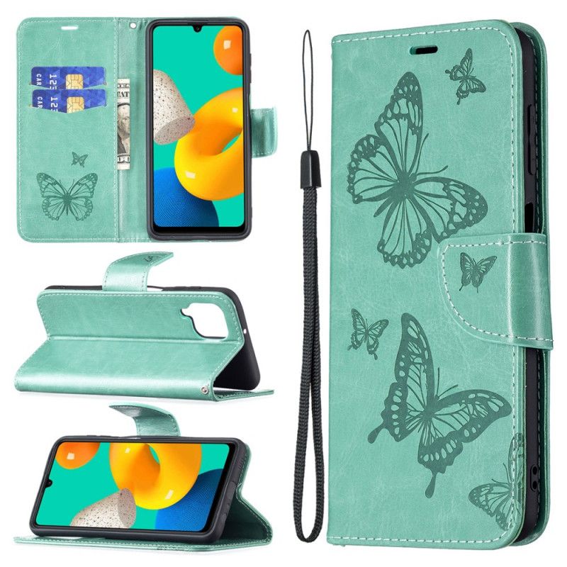 Housse Samsung Galaxy M32 Les Papillons En Vol Avec Lanière