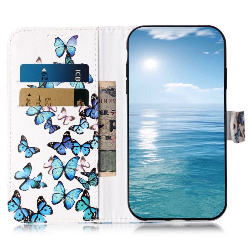 Housse Xiaomi Redmi Note 14 Pro 4G Vol de Papillons Bleus